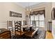 Formal dining room with hardwood floors, decorative chandelier, and beautiful wood table with chairs at 959 Sagamore Dr, Louisburg, NC 27549