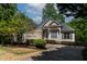 Charming one-story home features a stone accent wall and manicured landscaping at 959 Sagamore Dr, Louisburg, NC 27549