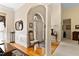 Inviting foyer with hardwood floors, white columns, and a view of the front door at 959 Sagamore Dr, Louisburg, NC 27549
