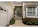 A welcoming front door with stone accents and lush greenery at 959 Sagamore Dr, Louisburg, NC 27549