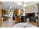 Bright eat-in kitchen with wood cabinetry, stainless steel appliances, and open layout at 959 Sagamore Dr, Louisburg, NC 27549