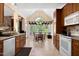 Eat-in kitchen featuring a vaulted ceiling, large window, and view to the backyard at 959 Sagamore Dr, Louisburg, NC 27549