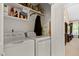 Bright laundry room with washer, dryer and built in storage at 959 Sagamore Dr, Louisburg, NC 27549