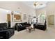 Comfortable living room with vaulted ceiling, neutral walls, plush furnishings, and open view to the kitchen at 959 Sagamore Dr, Louisburg, NC 27549