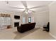 Spacious living room featuring a fireplace and comfortable brown leather seating at 959 Sagamore Dr, Louisburg, NC 27549