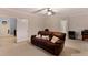 View of the living room with a comfortable brown leather sofa at 959 Sagamore Dr, Louisburg, NC 27549