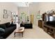 Well-lit living room featuring neutral decor, vaulted ceiling, and an inviting seating arrangement at 959 Sagamore Dr, Louisburg, NC 27549