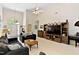 Bright living room with vaulted ceiling, neutral walls, open layout, and comfortable seating at 959 Sagamore Dr, Louisburg, NC 27549