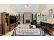 Bright living room with a stone fireplace, comfortable seating, and a large entertainment center at 959 Sagamore Dr, Louisburg, NC 27549