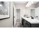 Bathroom vanity featuring granite counters, matte black fixtures, and open doorway at 4868 Pioneer Dr, Sanford, NC 27330