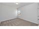 Bedroom with neutral walls, carpet floors and a window at 4868 Pioneer Dr, Sanford, NC 27330