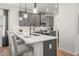 Stylish kitchen featuring a large island, gray cabinets, pendant lighting, and modern appliances at 4868 Pioneer Dr, Sanford, NC 27330