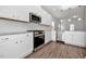 Modern kitchen with stainless steel appliances, granite countertops, and white cabinetry for a sleek design at 4868 Pioneer Dr, Sanford, NC 27330