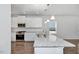 Bright kitchen features stainless appliances, granite counters, and white cabinets at 4868 Pioneer Dr, Sanford, NC 27330