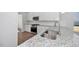 Well-lit kitchen with granite countertops, stainless steel appliances, and ample cabinet space at 4868 Pioneer Dr, Sanford, NC 27330
