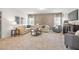 Spacious living room with plush neutral carpet, stylish furniture, and large windows at 4868 Pioneer Dr, Sanford, NC 27330