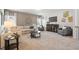 Bright living room showcases neutral walls, plush carpet, and ample seating at 4868 Pioneer Dr, Sanford, NC 27330
