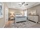 Spacious primary bedroom with tray ceiling, ensuite, and natural light at 4868 Pioneer Dr, Sanford, NC 27330