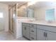 Contemporary bathroom with dual vanity, framed glass shower, and tile flooring at 10 Relaxing Way, Pittsboro, NC 27312