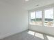 Bright, carpeted bedroom with two windows and scenic views at 10 Relaxing Way, Pittsboro, NC 27312