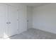 Comfortable bedroom featuring plush carpeting and paneled closet doors at 10 Relaxing Way, Pittsboro, NC 27312