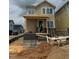 New home under construction featuring a brick foundation and a partially-built front porch at 10 Relaxing Way, Pittsboro, NC 27312