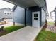Charming home exterior with blue siding, concrete walkway, and landscaping at 10 Relaxing Way, Pittsboro, NC 27312