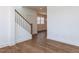 Open foyer with hardwood floors, white trim and staircase, creating a bright and welcoming entrance at 10 Relaxing Way, Pittsboro, NC 27312