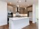 Modern kitchen boasts white countertops, an island, gray cabinets, and stainless steel appliances at 10 Relaxing Way, Pittsboro, NC 27312