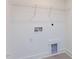 Functional laundry room featuring washer and dryer hookups with a shelf at 10 Relaxing Way, Pittsboro, NC 27312
