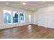 Spacious living room with hardwood floors, recessed lighting, windows, and a view of the entry at 10 Relaxing Way, Pittsboro, NC 27312