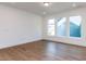 Bright living room with hardwood floors, recessed lighting, and large windows for ample natural light at 10 Relaxing Way, Pittsboro, NC 27312