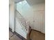 Bright staircase with white railing and trim leading to the upper level at 10 Relaxing Way, Pittsboro, NC 27312