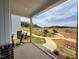 Scenic view from the porch overlooking the landscaped community area at 10 Relaxing Way, Pittsboro, NC 27312