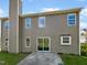 Exterior view of the home's rear facade with a patio area and well-maintained siding at 10 Sandy Bluff Ct, Durham, NC 27703