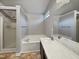Well-lit bathroom with a combined shower and tub, a vanity with a large mirror at 10 Sandy Bluff Ct, Durham, NC 27703