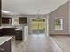 Bright kitchen features dark cabinets, light countertops, and sliding glass doors to the outside at 10 Sandy Bluff Ct, Durham, NC 27703