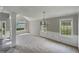 Welcoming living room with a bright, open floor plan and a flood of natural light from the many windows at 10 Sandy Bluff Ct, Durham, NC 27703