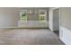 Inviting living room featuring neutral decor and large windows that let in ample natural light at 10 Sandy Bluff Ct, Durham, NC 27703