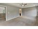 Large main bedroom with ceiling fan, neutral walls, and carpet flooring at 10 Sandy Bluff Ct, Durham, NC 27703