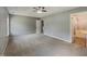Spacious main bedroom with a ceiling fan and ensuite bathroom, offering comfort and privacy at 10 Sandy Bluff Ct, Durham, NC 27703