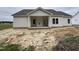 Home exterior with a covered back porch and a blank slate yard at 1000 Peedin Rd, Selma, NC 27576
