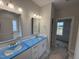 Elegant bathroom featuring dual sinks, modern fixtures, and plenty of counter space for a luxurious experience at 1000 Peedin Rd, Selma, NC 27576