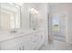 Elegant bathroom with double vanity, chrome fixtures, and a hexagon tile floor at 1000 Peedin Rd, Selma, NC 27576