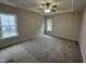 Cozy bedroom with soft carpet, neutral walls, and ample natural light, creating a peaceful and inviting atmosphere at 1000 Peedin Rd, Selma, NC 27576