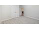 This bedroom features neutral carpet and a closet at 1000 Peedin Rd, Selma, NC 27576