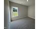 Comfortable bedroom featuring neutral paint, plush carpet, and lots of natural light from a window at 1000 Peedin Rd, Selma, NC 27576