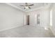 Neutral bedroom featuring neutral carpet, white trim, and an open door leading to the bathroom at 1000 Peedin Rd, Selma, NC 27576