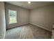 Cozy bedroom featuring a window view and neutral carpeting, ready for personalization at 1000 Peedin Rd, Selma, NC 27576