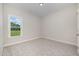 This bedroom features neutral carpet and natural light from the window at 1000 Peedin Rd, Selma, NC 27576